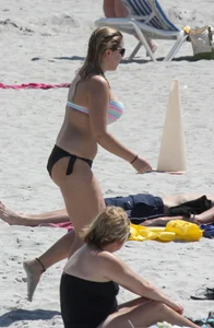 Big boobed thick blonde on the beach in a bikini
