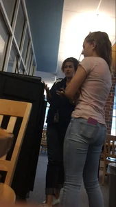 Very cute teen candid girl wearing tight jeans with a phone in back pocket