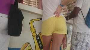 Milf in yellow shorts with vpl and a wedgie