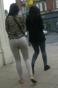Brunette lady with a nice ass in light grey leggings walking