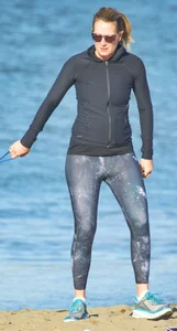 Beach redhead milf in patterened leggings at the beach