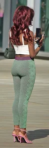 Slim ebony teens in leggings posing in the sun
