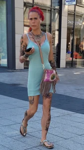 Candid Girl in Short Dress With a Tattooed Body Street Creepshots Gallery