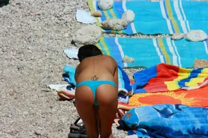 Ula FKK Sexy brunette on a nude beach topless, bottomless and with blue thong