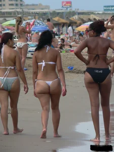 Bunch of sexy babes at the beach in thong bikinis