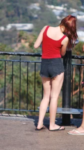 Redhead beauty in short shorts showing some cheeks and panties