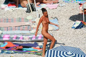Ula FKK Sexy brunette on a nude beach topless, bottomless and with blue thong