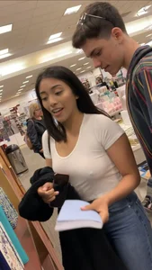 Pretty babe in tight jeans showing nipples in book store w bf (Not OC)(Face shot)