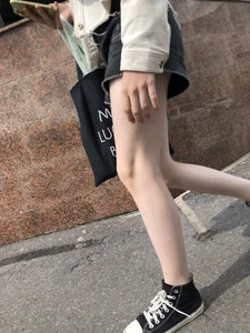 Cute candid teen with pale slim legs in shorts