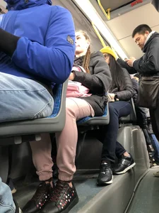 Very cute candid teen sitting in a public bus