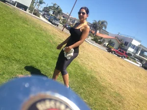 Hot brunette babe in leggings walking her dog with a nice ass and some cleavage