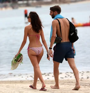Curvy wide hipped and big bootied brunette on the beach