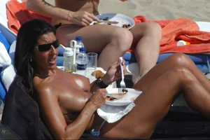 Girls on a nude beach in Sitges, Spain