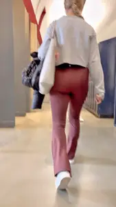 Pt.2 blonde with a nice ass going up the stairs in maroon flared leggings