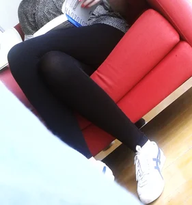 Crossed Skinny Legs in Black Tights Closeup Creepshot