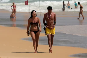 Sexy Asian on the beach with nice boobs and ass