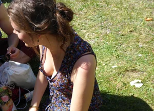 2 sexy girls showing nice cleavage while sitting together