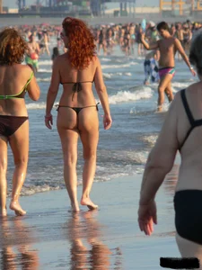 Bunch of sexy babes at the beach in thong bikinis