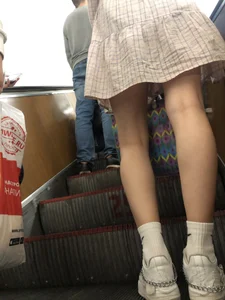 Cute Girl in a Dress with Thin Hot Legs Standing on the Subway Escalator Closeup Creepshots Gallery
