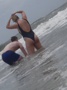 Thick blonde on the beach with a big booty in a blue swimsuit