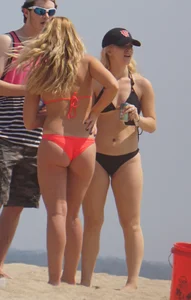 Sexy thick blonde girl with tiny bikini and big booty on the beach