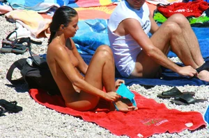 Ula FKK Sexy brunette on a nude beach topless, bottomless and with blue thong