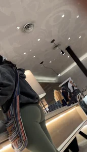 Sexy bubble butt in tight green leggings at the mall