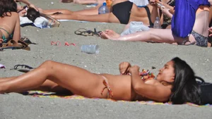Pretty brunette in a bikini at the beach