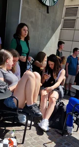 A Nice Candid Girl in a Top And Denim Shorts Hanging Out With Her Friends in a Street Cafe, Great Legs