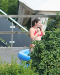 Thick babe in the backyard in red bikini