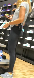 Shoe store employee with a sexy bubble butt in leggings