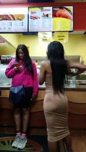 Slim and petite ebony babe in tight dress with vpl