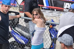 Skinny babe with a cute little ass in tiny blue shorts