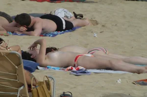 Topless girls on a beach in Barcelona