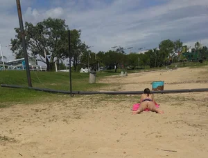 White thong brunette babe laying out on the beach with her dog
