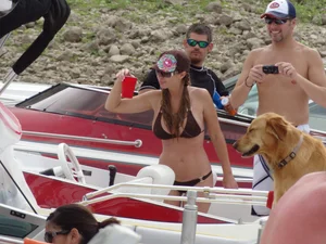 Party girls looking sexy out on boats in bikinis