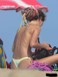 Sexy girls going topless at the beach showing off their sexy bodies