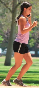 Hot brunette running in short shorts with vpl