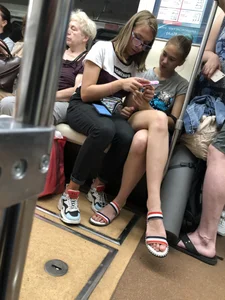 Tall Candid Teen Girl in Denim Shorts And Sandals Sitting in the Subway Train, Then Walking Down the Station