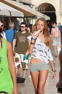 Sexy skinny blonde eating ice cream in short tight grey shorts