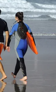 Candid surfer babes on the beach and in bikinis