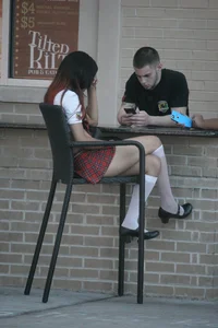 Two sexy Tilted Kilt employees showing cleavage and cheeks