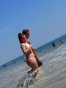 Big booty teen at the beach in a white bikini