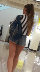 OC! Super cute brunette in jean short shorts with cheeks out and bikini tan lines up escalator! OC!