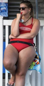 Thick blonde lifeguard in red swimsuit
