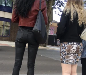 Chav brunette with a nice ass and vpl in tight black leather pants