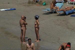 Girls on a nude beach in Sitges, Spain