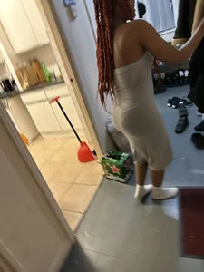 Very cute girl wearing a long tight grey dress kitchen creepshots