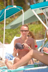 Bunch of sexy girls and milfs in bikinis at the beach