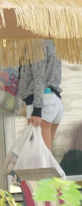 Girl next door teen neighbor bringing in groceries in short jean shorts